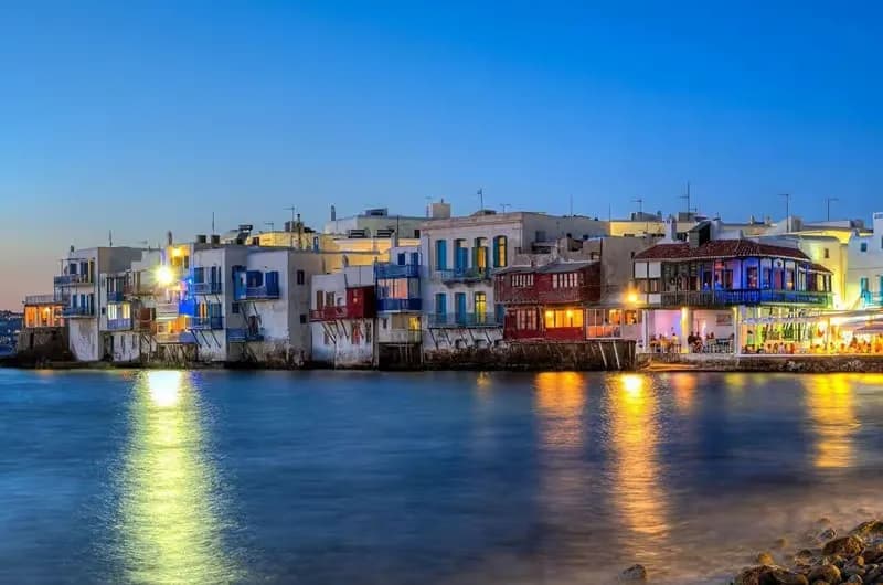 Little Venice waterfront houses in Mykonos Town at dusk, Greece